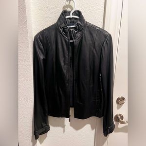Black faux leather jacket. Waist length